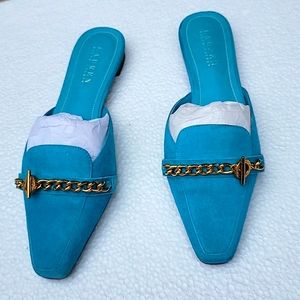 Turquoise suede shoes.